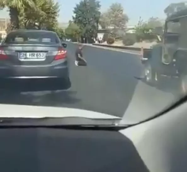 Image from Turkey!  He prays in the middle of the road and ignores the flowing traffic.