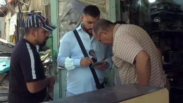 Bağdat'ın tek gramafon tamircisi Ebu Talip, 26 yıldır bozuk gramafonlara ses veriyor
