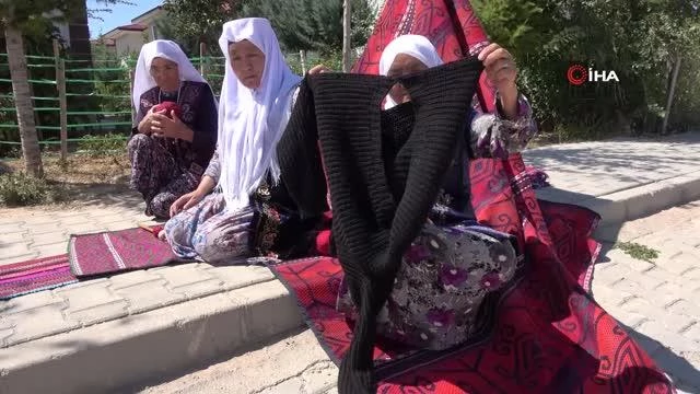 Eski elbiselerden sökülen ipler, Kırgız bayanlarının maharetli ellerinde halı ve kilime dönüşüyor