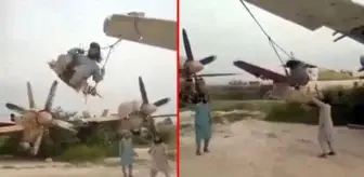Taliban, ABD'ye ait askeri uçakların kanatlarını salıncağa çevirdi