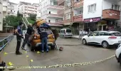 Tartıştığı kişinin iş yerine ateş açan şahıs, kavgayı ayırmayı çalışan genci vurdu