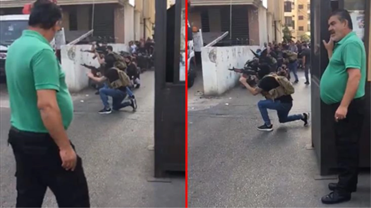 Beyrut'taki silahlı çatışmaların ortasında kalan adam rahat halleriyle dikkat çekti