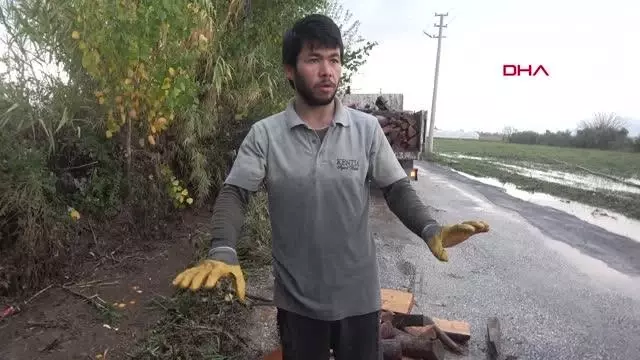 SAĞANAKTA DEPODA MAHSUR KALAN İŞÇİLER İŞ MAKİNESİYLE KURTARILDI