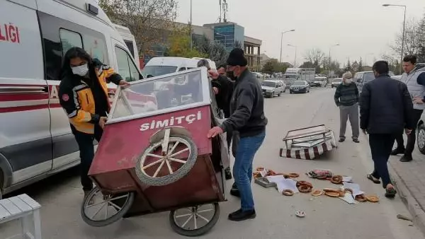 FIRTINADA DEVRİLEN SİMİT ARABASININ ALTINDA KALAN SİMİTÇİ AĞIR YARALANDI