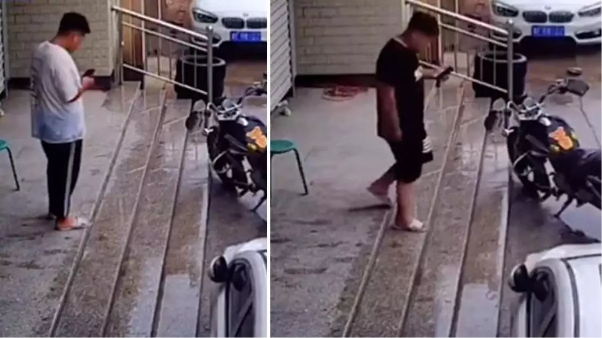 Yağmurlu havada banyo terliğiyle kaygan merdivenden inmeye çalışan genç, iki denemede de aynı sonucu aldı