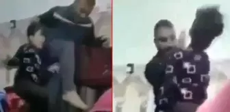 Karnesini beğenmediği kızını ters çevirip yerden yere vurdu! Cani babanın öldüresiye dayağı kamerada