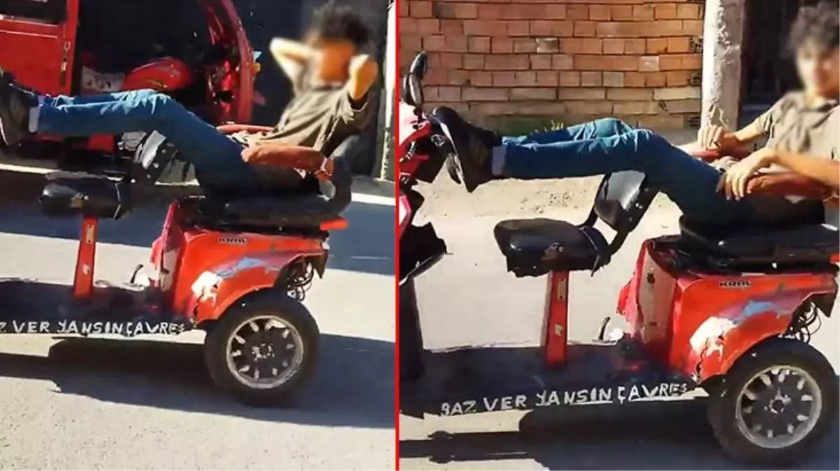 Motosikletini dakikalarca ayağıyla sürdü, kendisini çeken kameraya ise hiç aldırmadı