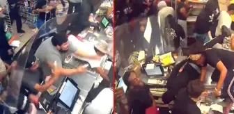 Bir grup çete, girdiği marketi saniyeler içinde soyup soğana çevirdi! Çalışanlar izlemekle yetindi