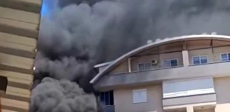 Alanya'da bir apartmanın bahçesinde çıkan yangın çevredeki binalara sıçramadan söndürüldü