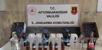 Afyonkarahisar'da Hakaret Suçundan Aranan Şahsın Evine Baskın: Kaçak Alkol ve Malzemeler Ele Geçirildi