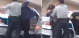 Polis memuru sokak ortasında kadını tekme tokat dövdü