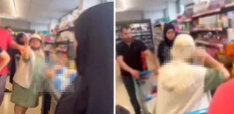 Markette başörtülü kadınlara çirkin saldırı! Kaydedilen görüntüleri başını yaktı