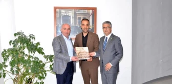 MHP Erzurum Milletvekili Prof. Dr. Kamil Aydın Erzurum Ticaret ve Sanayi Odası Başkanı Saim Özakalın'ı ziyaret etti