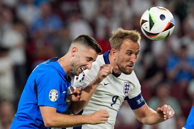 England and Slovenia, who drew 0-0, holding hands in the round of 16