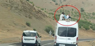 Siirt'te minibüsün üzerinde yolculuk yapan 4 kişi cep telefonuyla kaydedildi