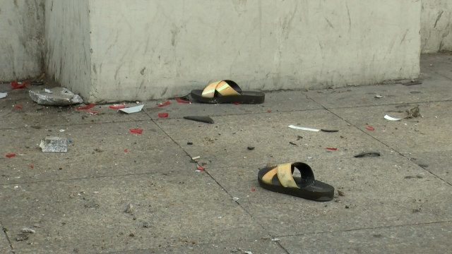 Police vehicle severely injured two pedestrians by trapping them against a wall while reversing