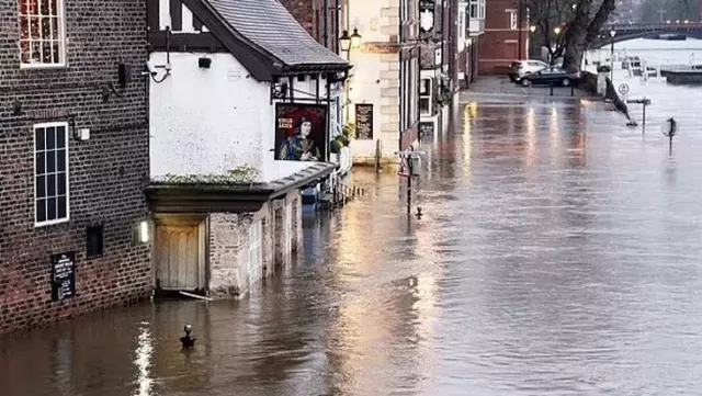 Severe rainfall in England has paralyzed life: Schools closed, matches postponed.