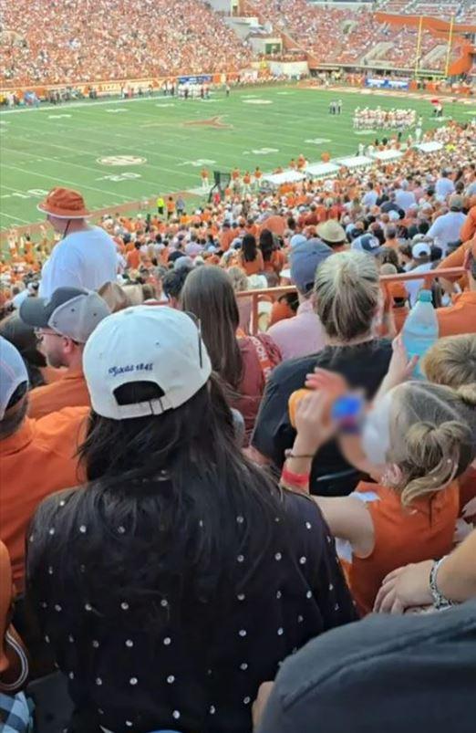 The mother of the girl drinking beer at a football game in Texas received backlash for not intervening