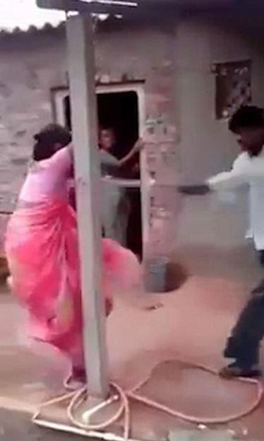 A husband in India, whose wife cheated on him, tied her and her lover to a tree and beat them