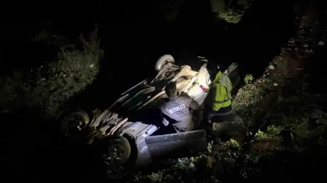 They were being searched for as missing persons and were found injured in a car that had rolled into a ditch.