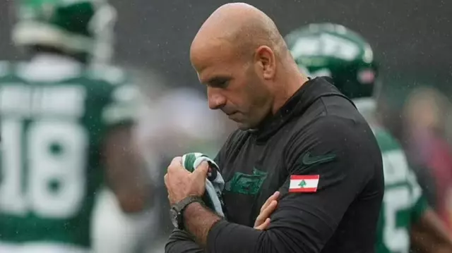 In the United States, a Muslim head coach who wore a Lebanese pin has been removed from his position.