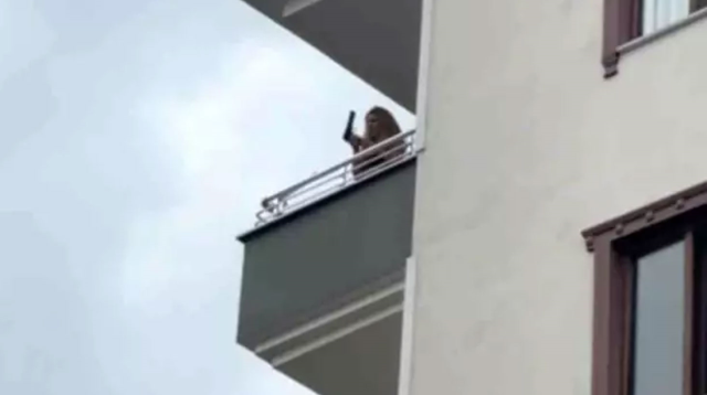 She seemed to be crazy, dancing while shooting from the balcony