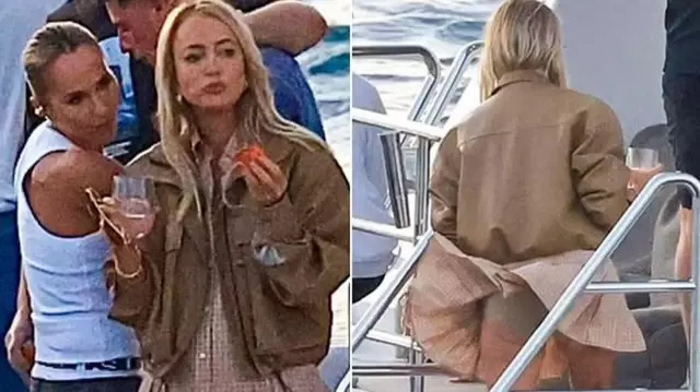 Famous radio host Jackie 'O' Henderson was caught off guard by the wind while having fun on a yacht with her friends.