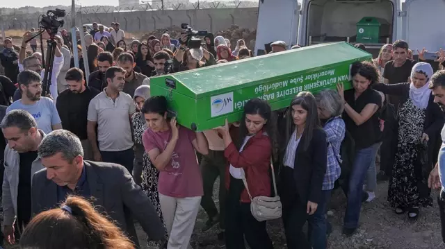 The women carried the coffin of Rojin, whose lifeless body was found.