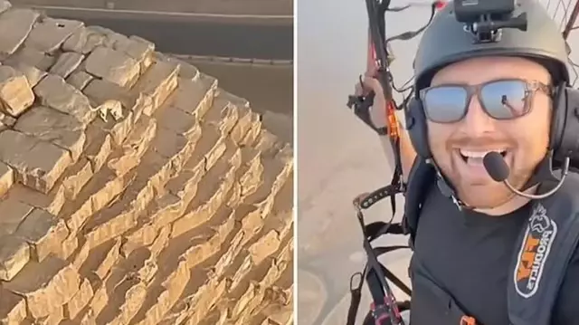 The paraglider saw a dog wandering at the top of the Giza Pyramid.