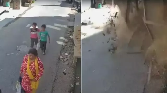 Two children walking on the street narrowly escaped being trapped under the collapsed building by just seconds.