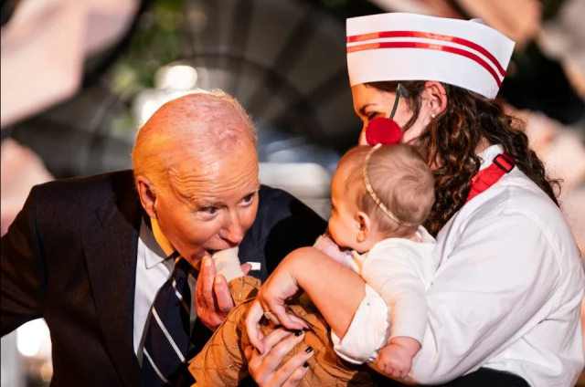 U.S. President Biden pretended to bite three babies at the White House Halloween party