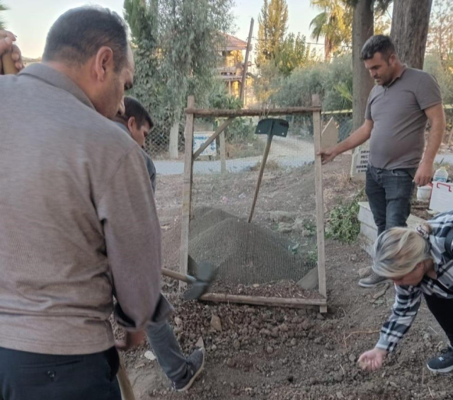 They found 1100 silver coins while digging a grave