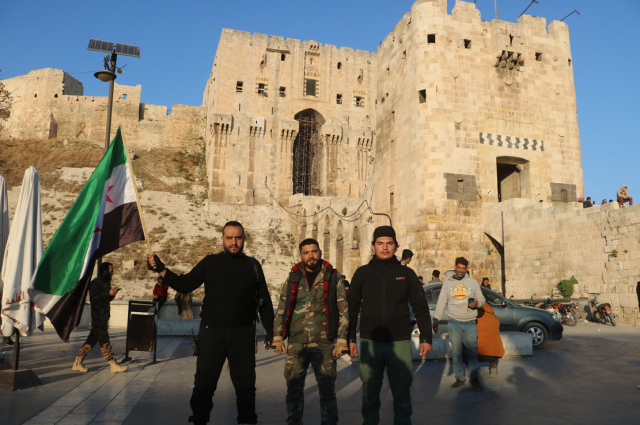 Opposition Victory Celebration in Aleppo: Erasing Assad's Traces