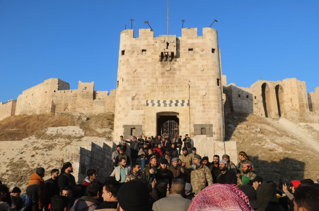 Opposition Victory Celebration in Aleppo: Erasing Assad's Traces