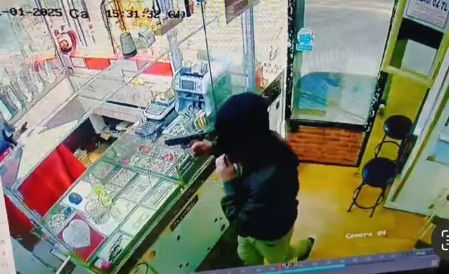 The jeweler realized the gun was a toy and beat the robber