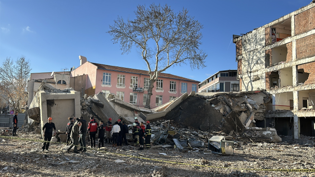 4-story building collapsed, excavator operator trapped under rubble