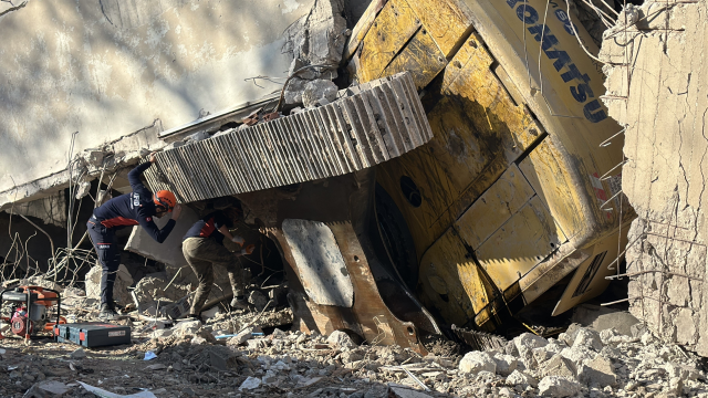 4-story building collapsed, excavator operator trapped under rubble