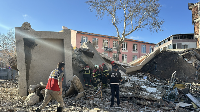 4-story building collapsed, excavator operator trapped under rubble