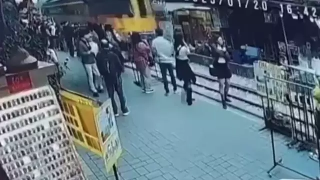 She touched the train while posing and fell onto the tracks