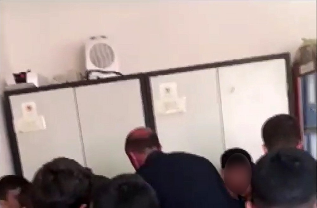 The principal beat the students with punches and kicks