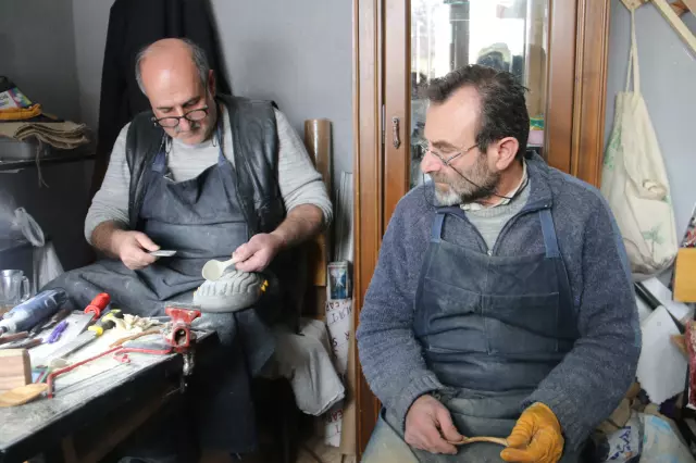 Retired Halit Yıldızeli from Sivas is apprenticing in the art of wooden spoon carving