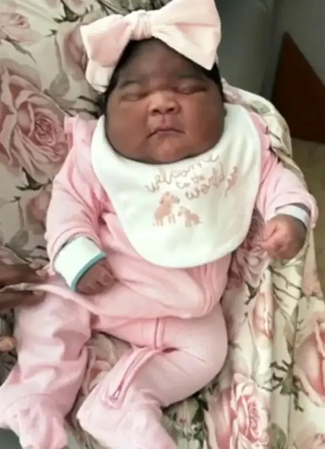 She started crying when she saw her baby! 2 weeks old but wearing 6-month-old clothes