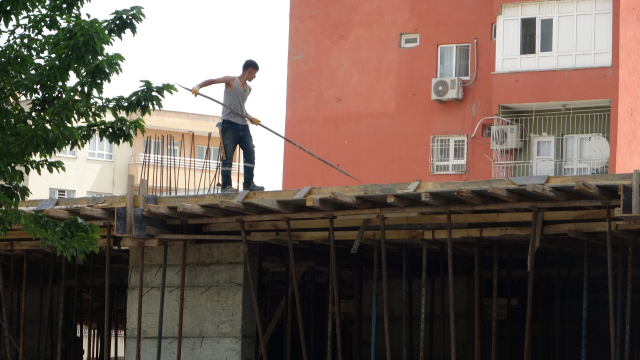 Construction workers in Batman watched the May 1 celebrations while working
