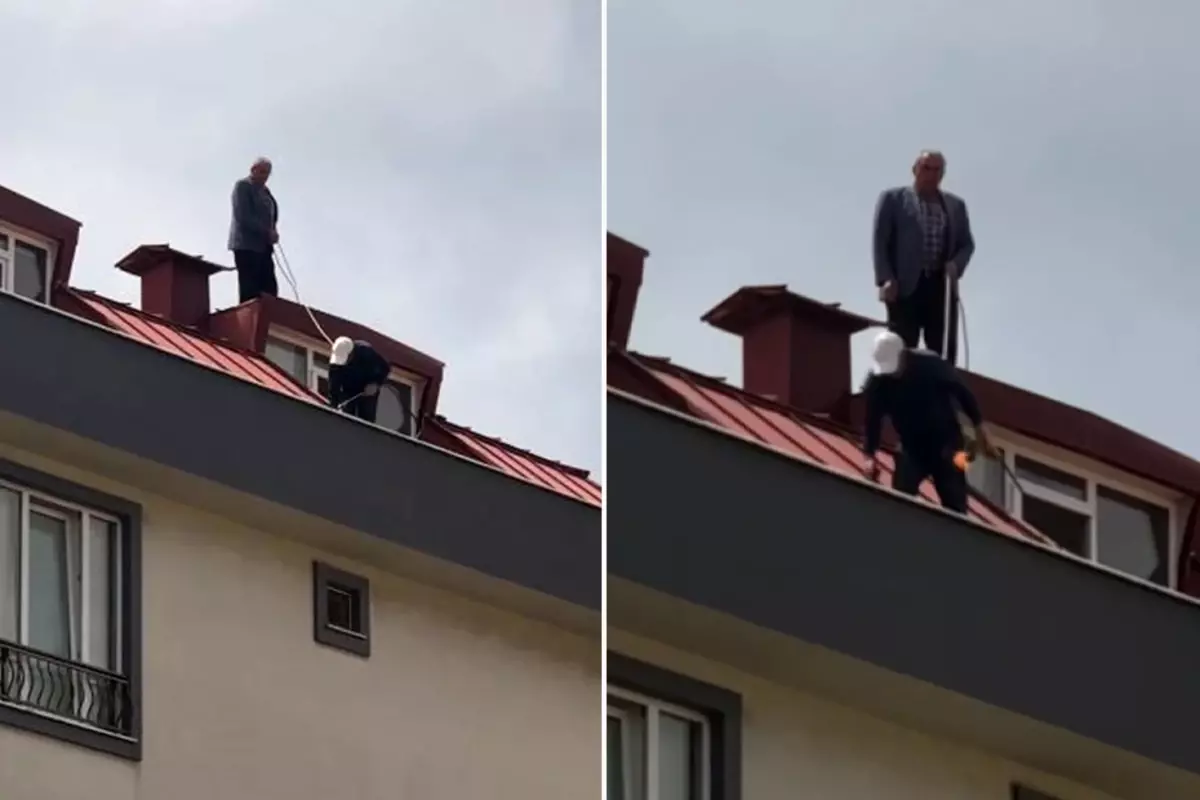 Çatı tadilatı yapan işçi beline ip bağlayarak güvenlik önlemi aldı