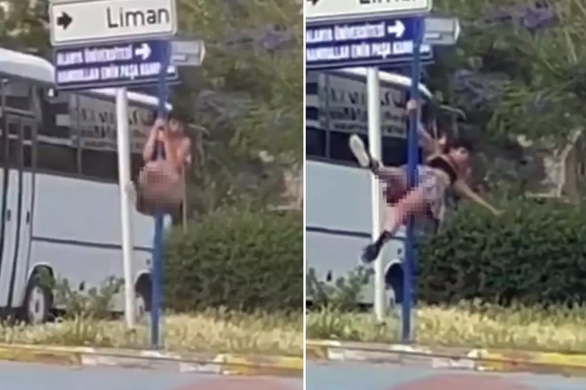 Trafikteki yön levhasında direk dansı yaptı