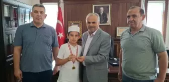 Mikail Çetinkaya'dan Örnek Davranış: Kazandığı Altını Filistinli Çocuklara Bağışladı