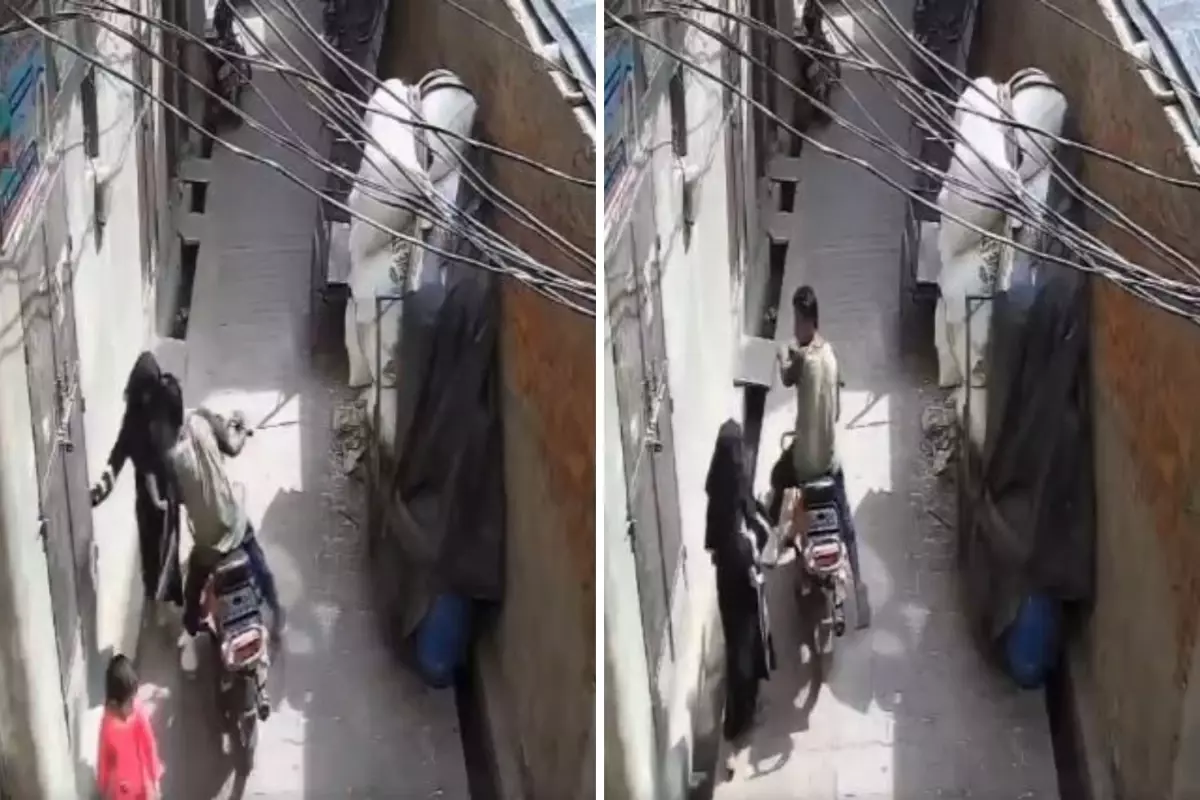 Motosikletli genç, sokakta sıkıştırdığı kadını zorla öptü
