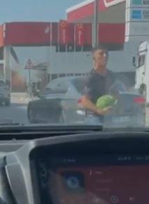 Stole watermelon from a truck stopped at a red light