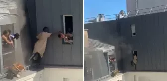 Kahraman kapıcı, yanan binanın 6. katından dört bebeği canını hiçe sayarak kurtardı