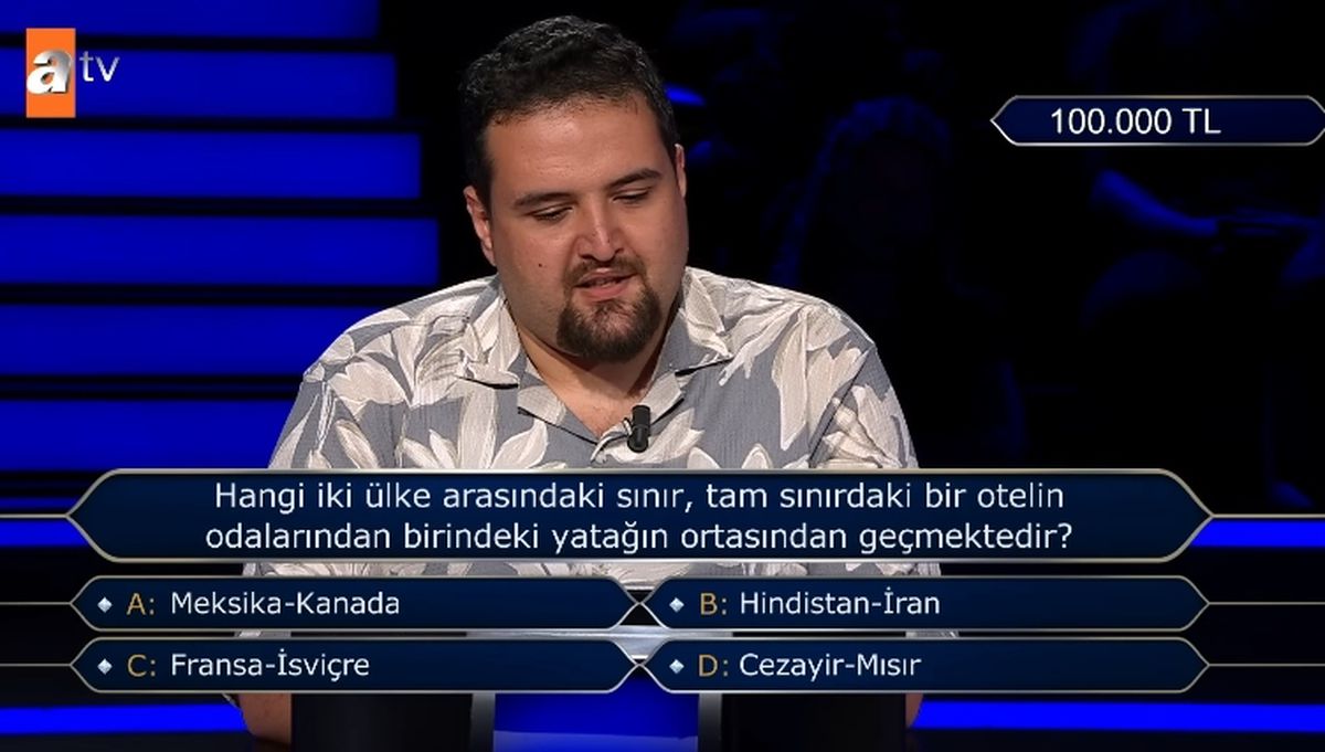 Hangi iki ülke arasındaki sınır, tam sınırdaki bir otelin odalarından birindeki yatağın ortasından geçmektedir?